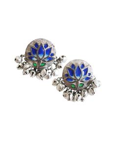 Blue Lotus Silver Studs : Handcrafted silver studs inspired from œPichwai" motifs with handpainted enamel.Size: 2.5cmx2.5cm Weight : 20 grams.Color:Blue and silver Care:If your design has enamel then each piece will be different from each other as they are hand painted. The metal used in making jewelry is silver plated brass. Please keep the jewelry in the given zip lock pouch. Avoid contact of jewelry with water. Avoid contact with harsh chemicals or cosmetics after wearing jewellery.Compositio Silver Jewelry With Peacock Design For Puja, Silver Peacock Design Jewelry For Puja, Traditional Blue Hand Painted Jewelry, Traditional Blue Hand-painted Jewelry, Silver Earrings For Diwali Puja, Silver Earrings For Puja And Diwali, Hand Painted Festive Earrings For Festivals, Traditional Blue Enamel Earrings, Silver Enamel Earrings For Wedding