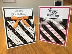 two handmade birthday cards with bows on them sitting on top of a wooden table