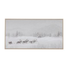 a horse drawn sleigh in the middle of a snow covered field with trees