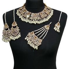 Asian jewellery set. Set includes- Necklace  Earrings  Tikka Jhumar Traditional Gold Jewelry With Stone Work, Gold Jewelry With Stone Work For Festivals, Gold Jewelry With Stone Work For Ceremonial Occasions, Ceremonial Gold Jewelry With Stone Work, Wedding Jewelry For Eid With Tilla Detail, Festive Kundan Jewelry With Stone Work, Kundan Chandbali Wedding Jewelry, Temple Jewelry Chandbali For Wedding, Gold Jewelry Sets With Stone Work For Eid