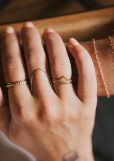 Jess hand-styled this stack just for you. She loves it, we love it, you'll love it! 5mm band width when worn together. We hammered flat our Teeny-Tiny band, Valley Ring and Beaded Ring to unite forces and create an eye-catching combo. Available in 14kt Gold Fill + Sterling Silver. Shown with our Dani Chain Ring and Swell Ring. Handmade in Eau Claire, WI. Our jewelry is handmade so each piece will be unique and may vary slightly from what is pictured. Left Hand Rings, Triple Ring, Beaded Ring, Hand Ring, Everyday Rings, She Loves, Beaded Rings, Chain Ring, Ring Handmade