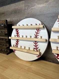 two baseball themed wall shelves with wooden pegs