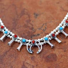 Genuine Navajo Native American Squash Blossom Choker 16 1/2" Sterling Silver Necklace. It Is Made From Pure Shiny 925 Sterling Silver And Beautiful Baby Blue Genuine Turquoise And Red Coral. It Is About 16 1/2" From End To End And The Naja Measures 5/8". This Lovely Necklace Is Some Of The Finest Work By Famous Navajo And Zuni Artists Including The Calavaza Family, Alex Sanchez, Thomas Singer, Nakai, Herbert Cellicion, Ella Peter, Edaakie, And Many More. All Jewelry Navajo Native American Pieces Alex Sanchez, Native American Turquoise Jewelry, Native American Necklace, Tiered Necklace, Jewelry Holders, Multi Chain Necklace, Zuni Jewelry, Green Beaded Necklace, Turquoise Jewelry Native American