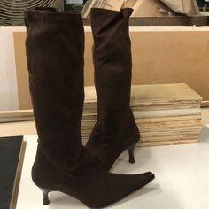 Tall Boots In Brown Suede With Pointy Toe And 2” Heel With Overall Height Of 17” Fitted Suede Boots With Round Toe, Fitted Low Heel Boots With Reinforced Heel, Brown Fitted Low Heeled Boots, Fitted Brown Boots With Low Heel, Casual Fitted Low Heel Boots, Fitted Suede Low Heel Boots, Fitted Suede Boots With Reinforced Heel, Casual Fitted Suede Heeled Boots, Fitted Suede Knee-high Boots With Almond Toe