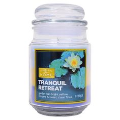 a jar of tranquill retreat with flowers on it's lid