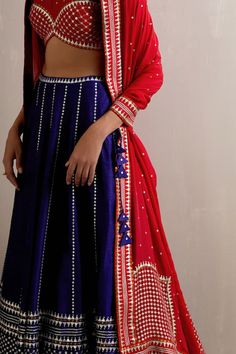 Ink blue attached cancan lehenga with aari, sequin, zari embroidery in stripe pattern. Paired with red half sleeve embroidered padded blouse and dupatta. - Aza Fashions Traditional Palazzo Set With Dori Work For Party, Royal Blue Art Silk Sets For Festivals, Traditional Royal Blue Sets For Navratri, Designer Blue Pre-draped Saree With Gota Work, Blue Art Silk Sets With Mirror Work, Blue Pre-draped Saree With Gota Work, Blue Pre-draped Saree With Gota Work For Reception, Royal Blue Sharara For Navratri Party, Royal Blue Choli For Party And Festivals