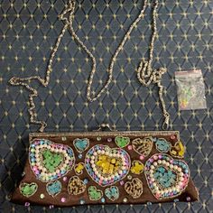 Nwt Stunning Piece Hand Beaded Bag With Color Stones, Heart Designs All Beats Are In Place, Silver Long Chain Strap Can Be Remove To Convert As A Clutch Bag. Preloved Almost New Bring The Extra Bag Of Beads! Brown Satchel Evening Bag For Party, Brown Beaded Pouch Shoulder Bag, Brown Pouch Shoulder Bag For Party, Brown Crossbody Shoulder Bag For Party, Brown Beaded Pouch Bag, Brown Crossbody Evening Bag For Parties, Juicy Couture Earrings, Mini Hand Bag, Hand Beaded Bag