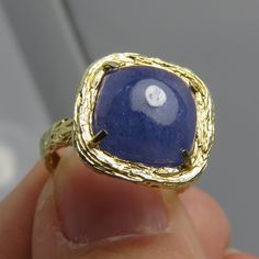 Estate very nice 14k size 5 large cushion cut cabochon purple tanzanite stone 9.54mm. 3.5 grams. beautiful detail work on ring. marked 14k. by pz isral. Purple Tanzanite, Mystic Topaz Ring, Baby Rings, Tanzanite Stone, Tanzanite Ring, Wide Band Rings, Mystic Topaz, Pinky Ring, Wide Bands