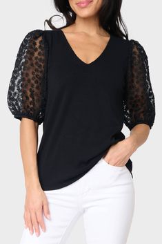 The Megan Mixed Media Soft Ponte Top is a perfect combination of classic and modern. This top features embroidered puff sleeves and a V-neck, creating a timeless yet chic look. It's made of a soft ponte fabric for all-day comfort and style. 93% Rayon | 7% Spandex Hand Wash Cold, Dry Flat. Length 25" Mei Li is 5'3 and wearing size XS Black V-neck Puff Sleeve Top For Fall, Chic Black V-neck Puff Sleeve Top, Chic Stretch Puff Sleeve Top With V-neck, Chic Stretch V-neck Puff Sleeve Top, Stretch Puff Sleeve V-neck Top For Spring, Spring V-neck Stretch Puff Sleeve Top, Stretch V-neck Puff Sleeve Top For Spring, V-neck Black Puff Sleeve Top For Fall, Chic Black Puff Sleeve Top With V-neck