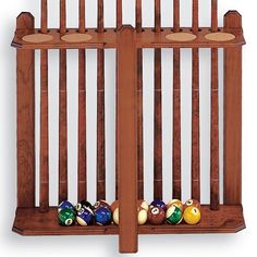 two wooden racks with pool balls in them