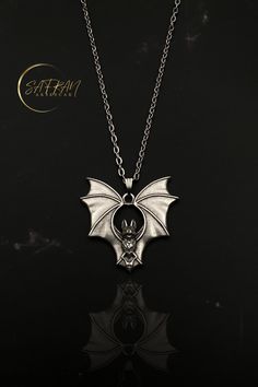 🦇 Embrace your dark elegance with our stunning sterling silver gothic bat wing necklace, a perfect blend of mystique and sophistication. Handcrafted with meticulous attention to detail, this bat necklace captures the essence of gothic allure, making it an eye-catching statement piece for any outfit. The delicate bat wings are intricately designed, reflecting a haunting beauty that is both timeless and enchanting. 🦇 What sets our gothic bat wing necklace apart is the unparalleled craftsmanship and creativity poured into each piece. Every necklace is uniquely handcrafted, ensuring that no two are exactly alike. This dedication to artisanal quality not only guarantees a beautiful product but also supports the tradition of handmade artistry that Etsy is renowned for. Whether you're treating Gothic Necklaces For Halloween Costume Party, Gothic Halloween Costume Necklace, Vampire Style Necklaces For Halloween Cosplay, Vampire Style Necklace For Halloween, Necklace Vampire, Haunting Beauty, Bat Jewelry, Bat Necklace, Horror Gifts