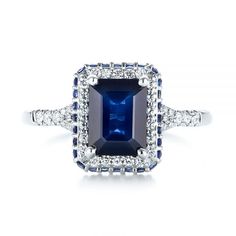 Custom Blue Sapphire and Diamond Halo Engagement Ring - Top View - 103457 - Thumbnail Emerald Cut Sapphire Ring Vs Clarity, Classic Sapphire Rings With Pave Setting, Blue Emerald Cut Diamond Ring With Halo Setting, Classic Blue Rings With Pave Setting, Blue Pave Setting Anniversary Rings, Blue Diamond Promise Ring With Pave Setting, Sapphire Colored Vvs Clarity Baguette Cut Diamond Ring, Sapphire Color Baguette Cut Diamond Ring With Vvs Clarity, Lab-created Sapphire Diamond Ring With Emerald Cut