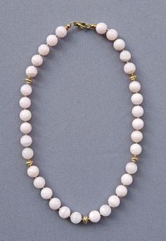 The banded beads of mangano-calcite look ivory-like with a touch of pink, accentuated by the light gold shade of the tiny golden beads between the calcite beads and the four symmetrically placed large golden rondelles. The ends of the necklace are decorated and protected with golden rings and beads. Including the beautiful and secure lobster clasp, everything is handcrafted in bright goldfilled metal (see FAQ). The necklace is approx. 45 cm long. The calcite beads have diameters of approx. 11 mm Mangano Calcite, Golden Rings, Golden Beads, Golden Ring, Stainless Steel Wire, The Four, Beaded Necklace, Jewelry Necklaces, Accessory Gift