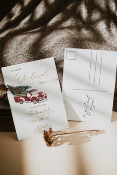 the wedding stationery is laid out on the bed