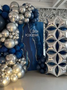 some silver and blue ornaments are on display