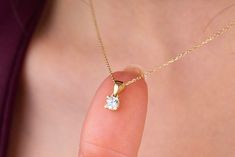 Our round cut solitaire pendant necklace is 14k solid gold. It has a minimalist style that can fit all of your outfits. The stone is made of cubic zirconia. This delicate charm has 2 different colors; gold and white gold, and also 2 different sizes; 4 mm and 5.50 mm. All of them have 4 prongs. If we talked about features of this circle pendant: The diameter of the smallest pendant is 4 mm, and the height of it is 10.37 mm. The diameter of the other pendant is 5.50 mm, and the height of it is 12.71 mm. We also have the 4-prong model of the same style pendant. Here is the link of it: https://www.etsy.com/listing/1625149972/14k-solid-gold-round-cut-solitaire If you want to combine it with earrings, here is the link:  This pendant will be the perfect ring as a romantic gift for your partner. L Delicate 14k Gold Solitaire Necklace With Prong Setting, Minimalist Solitaire Necklace With Prong Setting For Everyday, Minimalist Everyday Solitaire Necklace With Prong Setting, 14k Gold Minimalist Solitaire Necklace For Anniversary, 14k Gold Solitaire Necklace For Everyday, Minimalist Solitaire Necklace With Round Pendant, Everyday 14k Gold Solitaire Necklace, Dainty Everyday Solitaire Necklace With Prong Setting, 14k Gold Minimalist Solitaire Necklace For Formal Occasions