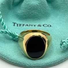 A Beautiful, High-End Authentic Tiffany & Co. 18k Yellow Gold Signet Ring With An Oval Onyx Stone Center Marked Tiffany & Co. And 750 Ring Size 9 Weighs 14.8 Grams *Does Not Come With Original Packaging! This Is For Staging Purposes Only! Thank You! :)* Onyx Signet Ring, Jewelry Tiffany, Gold Signet Ring, Tiffany Co Jewelry, Ring Color, Rings Cool, Onyx Stone, Signet Ring, Womens Jewelry Rings