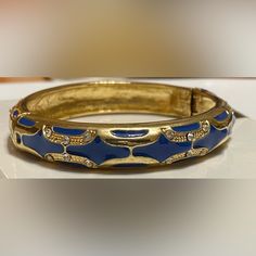 Beautiful Ornately Designed Bangle With Gold Accents. Blue Bracelet Strap Jewelry, Blue Jewelry With Bracelet Strap, Adjustable Blue Cuff Bracelet For Party, Trendy Blue Bangle Jewelry, Blue Bangle Cuff Bracelet For Party, Blue Cuff Bracelet Bangle For Formal Occasions, Blue Bangle Cuff Bracelet For Formal Occasions, Adjustable Blue Metal Bracelet, Adjustable Blue Metal Bracelets