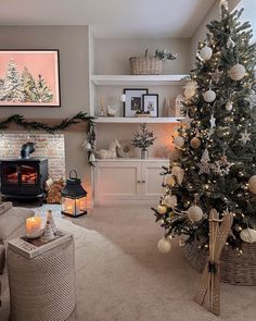 a living room with a christmas tree in the corner and other decorations on the wall