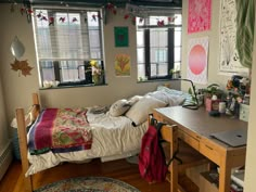 a bed room with a neatly made bed and lots of clutter on the floor