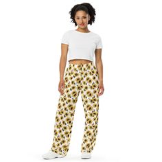 Upgrade your loungewear with our All-Over-Print Unisex Wide-Leg Pants, designed for ultimate comfort and style. These best-selling pants effortlessly blend fashion with function, making them perfect for everything from cozy pajamas to trendy streetwear. Whether you're lounging at home or stepping out, their super soft, stretchy fabric ensures comfort in every move. Crafted with premium knit mid-weight jersey fabric, these pants feature a relaxed unisex fit and an adjustable elastic waistband with a white drawstring for added comfort. Plus, the practical side pockets make them ideal for daily wear. Choose to wear them on the waist or hips for a customizable fit. The fabric's OEKO-TEX 100 standard certification guarantees safe, eco-friendly material that's gentle on the skin. Whether you're Pajama Pants Christmas, Floral Lounge, Unisex Pants, Cozy Pajamas, Trendy Streetwear, Pants Elastic Waist, Christmas Pjs, Pj Pants, Pantalon Large