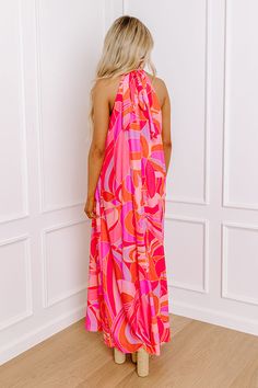 - Be as bold as you are fabulous in this vibrant maxi! Effortlessly chic with its flowy sleeveless cut, this dress is a celebration of vibrant hues. Its a perfect choice for making a statement at any occasion. Own the moment with this captivating dress! - Airy chiffon material with an abstract print featuring vibrant pinks, purples, orange, and yellow hues - A built-in lining ending above the knee - A mock neckline with back tie closure and a keyhole detail - A sleeveless cut - A relaxed silhoue Yellow Hues, Chiffon Material, Mock Neckline, Orange And Yellow, Above The Knee, Abstract Print, Chiffon, Maxi Dress, In This Moment