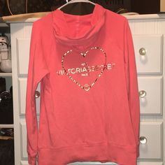 Victoria Secret Supermodel Essentials Full-Zip Sweatshirt. Bright Coral In Color With Gold Foil Heart That Says Nyc Victoria’s Secret Paris. Full Zip, With Good, Front Pockets. Size Large. This Has Been Worn Once, But Looks Brand New. No Rips Or Stains. Smoke Free Home. Victoria's Secret Casual Long Sleeve Sweatshirt, Victoria's Secret Long Sleeve Cotton Sweatshirt, Victoria's Secret Cotton Long Sleeve Sweatshirt, Victoria's Secret Long Sleeve Stretch Tops, Rochelle Rock, Secret Paris, Essentials Sweatshirt, Zip Sweatshirt, Gold Foil