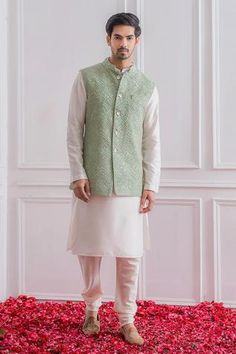 Mint green Lucknowi Nehru jacket with delicate thread and sequins embroidery.
Component: 1
Pattern: Embroidered
Type Of Work: Sequins
Neckline: Mandarin
Sleeve Type: Sleeveless
Fabric: Pure Georgette; Lining: Twill Satin
Color: Green
Other Details: 
Front button down jacket
Note: The kurta and churidar worn by the model is not for sale
Occasion: Mehendi and Haldi - Aza Fashions Mint Green Kurta Men, Mint Green Sherwani, Textiles Studio, Grooms Outfit, Groomsmen Outfit, Nikah Decor, Nehru Jacket For Men, Pakistani Kurta, Indian Suit