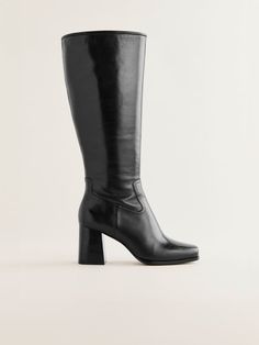 These boots were made for walking. Shop the Frederique Knee High Boot from Reformation, a knee-high, block heel boot with a thick square toe and seam detailing. Black Knee High Leather Boots, Classic Wide Calf Knee-high Boots With Block Heel, Classic Wide Calf Heeled Boots With Square Toe, Classic Knee-high Boots With Wide Calf And Block Heel, Wide Calf Block Heel Boots For Business, Classic Square Toe Wide Calf Heeled Boots, Formal Knee-high Platform Boots With Stacked Heel, Elegant Tall Heeled Boots With Stacked Heel, Fitted Calf Leather Knee-high Boots With Block Heel