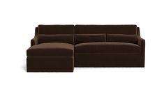 a brown sectional couch sitting on top of a white floor