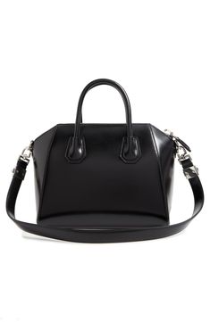 Beloved by street-style mavens the world over, Givenchy's Antigona satchel is updated in fine box calfskin leather, imparting subtle shine to the classic style. Top zip closure Top carry handles; removable shoulder strap Interior zip, wall and smartphone pockets Leather Made in Italy Designer Handbags Classic Satchel With Silver-tone Hardware, Evening Satchel In Smooth Grain Calf Leather, Formal Calf Leather Satchel, Classic Formal Calf Leather Satchel, Classic Calf Leather Satchel For Evening, Formal Leather Satchel With Silver-tone Hardware, Classic Evening Satchel With Palladium Hardware, Black Formal Satchel With Palladium Hardware, Classic Calf Leather Satchel For Everyday Luxury