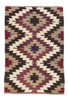 an old navajo rug with red, brown and white colors on it's sides