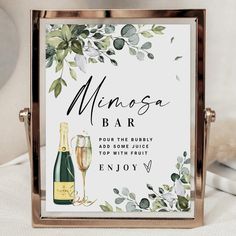 there is a sign that says mingsa bar and wine glasses on the table next to it