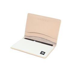 a white wallet with a card holder in it