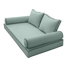 a gray couch with two pillows on it and one pillow is folded over the back