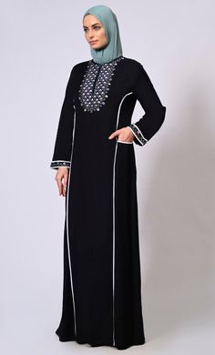 Introducing our exquisite Floral Embroidered Abaya, a timeless piece that seamlessly blends elegance with modern style. The intricate embroidery adds a touch of femininity and sophistication to the garment, making it perfect for any special occasion or everyday wear. Adding to its charm, the abaya showcases colored piping along the princess seams, enhancing its silhouette and creating a flattering, elongating effect. The piping adds a subtle pop of color, elevating the overall design and making Embroidered Abaya, Black Abaya, Princess Seams, Intricate Embroidery, Princess Seam, The Princess, Timeless Pieces, Modern Style, Color Pop