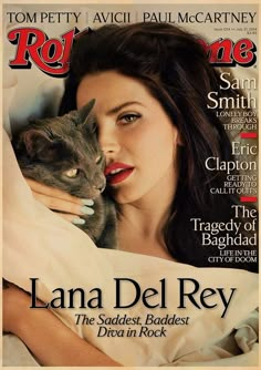 a woman laying in bed with a cat on the cover of rolling magazine, featuring lana del ray