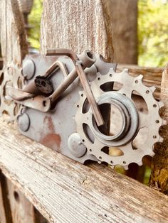 a close up of a bike chain on a wooden bench