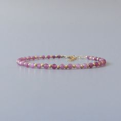 Fall in love with our dainty pink tourmaline  gemstone beaded bracelet, perfect timeless delicate minimalist design, handmade to be stacked or worn on its own. Will make a thoughtful birthday, Christmas, or anniversary gift for your wife, mother, sister, daughter, or friend. Tourmaline is October birthstone- Libra gift or 8th wedding anniversary gift.  Your purchase will arrive elegantly packed  in a gift-ready suede storage bag  and will include a complimentary cleaning cloth. Treat yourself or Pink Dainty Beaded Bracelets For Everyday, Dainty Pink Beaded Bracelets For Everyday, Minimalist Pink Beaded Bracelets With Tiny Beads, Minimalist Pink Beaded Bracelet With Tiny Beads, Minimalist Single Strand Beaded Bracelets For Gift, Minimalist Single Strand Beaded Bracelets As Gift, Minimalist Pink Tiny Beaded Bracelets, Delicate Pink Everyday Bracelet, Dainty Pink Stackable Beaded Bracelets