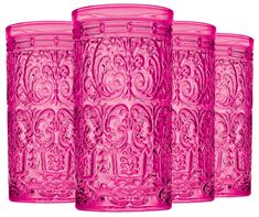 three pink glass vases sitting next to each other