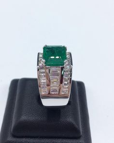 BRAND-NEW!! ONE OF A KIND, HANDCRAFTED RING. EXQUISITE AND FINE CRAFTSMANSHIP! HANDMADE TO LAST FOR AN ETERNITY!! HEIRLOOM PIECE!! PRECIOUS JEWELRY TO BE PASSED ON! PERFECT DRESS RING FOR A GENTLEMAN! 7.02 total carat weight, Certified, Natural emerald ring. This ring offers an important statement of who you are with a 4.76 carats, VIVID GREEN, transparent, ZAMBIAN EMERALD. Accentuating the EMERALD are the 48 SUBSTANTIAL F/VS, sparkling natural diamonds! Set in one of a kind, handmade 18K Solid Luxury Hallmarked Emerald Ring For Formal Occasions, Formal Rectangular Emerald Ring With Polished Finish, Luxury Rectangular Emerald Ring In White Gold, Classic Gia Certified Emerald Ring For Formal Occasions, Formal Classic Gia Certified Emerald Ring, Luxury Green Signet Ring For Formal Occasions, Luxury Green Signet Ring For Anniversary, Modern Emerald Signet Ring For Formal Occasions, Luxury Emerald Ring In White Gold With Polished Finish