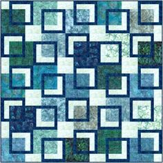 a blue and white quilt with squares on it