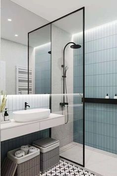 a bathroom with a shower, sink and mirror in it's center wall is shown