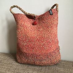 "Handmade crochet bag of natural materials. Great as shopping bag, festival bag, summer beach bag. Material: Linen Main colours: orange Colouring: red/beige/yellow/blue Sizes: Height handle 54 cm - 21\" Height 36 cm - 14\" Width 32 cm - 12.5\"" Multicolor Hand Knitted Crochet Bag For Beach, Multicolor Hand Knitted Crochet Bag For The Beach, Handwoven Orange Crochet Bag For Travel, Orange Handwoven Crochet Bag For Travel, Handmade Orange Crochet Bag For Travel, Handwoven Orange Crochet Bag For Summer, Summer Handwoven Orange Crochet Bag, Orange Summer Crochet Bag For Beach, Handmade Orange Beach Bag For Summer