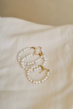 Our Kailani Bracelet is a beautiful beachy bracelet that is perfect to style everyday for this summer season. Made out of our freshwater nugget pearls and gold beaded accents, everyone will be asking you where you got your modern pearl bracelet. This is the kids version of our adult style Kailani bracelet Materials: freshwater nugget pearl Available sizes: Newborn-2 years (4"-5") 2-4 years (5"-5.5") 5-14 years (5.5"-6") Gold Bracelet With Pearl Charm For Beach, Gold Pearl Charm Bracelet For Beach, Gold Pearl Bracelet With Pearl Charm For Beach, Handmade Pearl Bracelet For Everyday, Beach Pearl Bracelet With Pearl Charm, Adjustable Pearl Drop Beaded Bracelets, Pearl Beaded Bracelets With Pearl Charm For Beach, Adjustable Pearl Bracelet With Gold Beads, Beach Beaded Bracelets With Pearl Charm