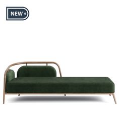 an image of a green couch with wood frame on it's legs and back