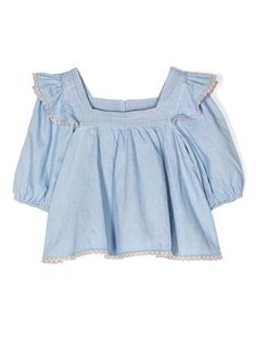 ZIMMERMANN Kids Halcyon Smocked Denim Blouse - Farfetch Spring Cotton Peasant Top With Square Neck, Blue Cotton Blouse With Smocked Cuffs, Spring Square Neck Top With Lace Trim, Spring Square Neck Tops With Lace Trim, Blue Denim Blouse With Puff Sleeves, Medium Wash Puff Sleeve Top For Spring, Medium Wash Cotton Puff Sleeve Top, Cotton Peasant Top With Ruffles And Puff Sleeves, Cotton Peasant Top With Puff Sleeves And Ruffles