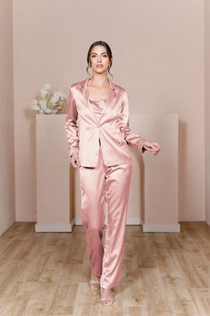 For the bridesmaid that doesn't want a dress, we have you covered! The new Ruby Satin Jacket & Pants set provides a glamorous alternative to a dress and will still have you feeling chic, confident, and comfortable all night long! The Ruby Jacket and Ruby Pants are sold separately. Lindsey size 4, pictured with the Flynn Satin Top in Desert Rose, sold separately. Laken size 24, pictured with the Heidi Chiffon Top in White Pearl, sold separately. FEATURES: Fitted Pants silhouette Side zipper Full- Pink Suits Women, Pants Silhouette, Jacket Silhouette, Bridesmaid Satin, Wedding Parties Colors, Fitted Pants, Satin Jacket, Blush Bride, Fitted Jacket