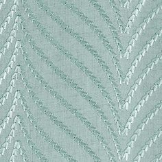 an upholstered fabric with silver threadwork on the edges and diagonals in rows