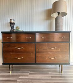 This item is **not for sale** DO NOT PURCHASE !  Shown to demonstrate my work. This MCM dresser by Ward Furniture has been beautifully refinished in "Jet Black" by Wise Owl Paint.  The drawers and legs have  been stripped and stained in "Special Walnut" by Minwax, and the whole piece has been sealed in a satin topcoat.  The interior of the drawers has been reconditioned with lemon scented furniture salve, and all four are dovetailed and glide smoothly. This chest is dated 1957, and is in excelle Black And Wood Dresser, Dresser Makeover Black, Mid Century Modern Furniture Makeover, Mid Century Modern Dresser Makeover, Modern Furniture Makeover, Modern Dresser Makeover, Furniture Salve, Mcm Dresser, Flip Ideas